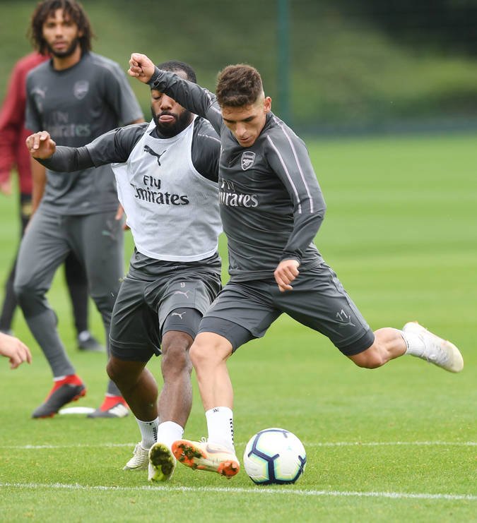 Lacazette and Torreira in training
